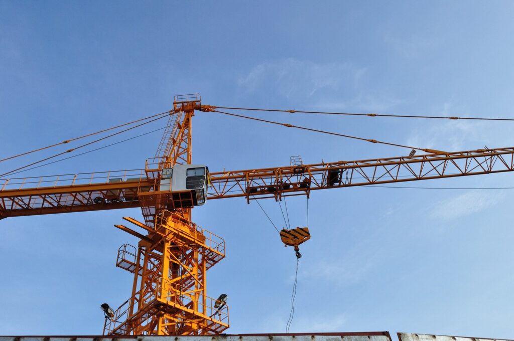 Tower crane on construction site of apartment blocks