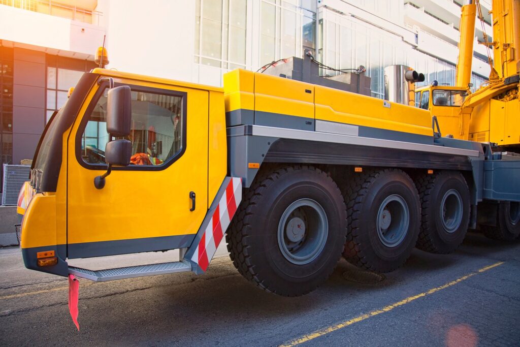 Mobile crane during steel construction assembly