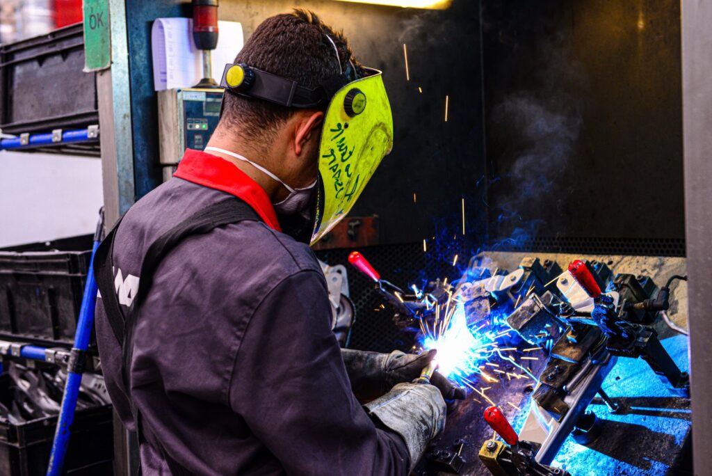 welder during welding with covered electrodes
