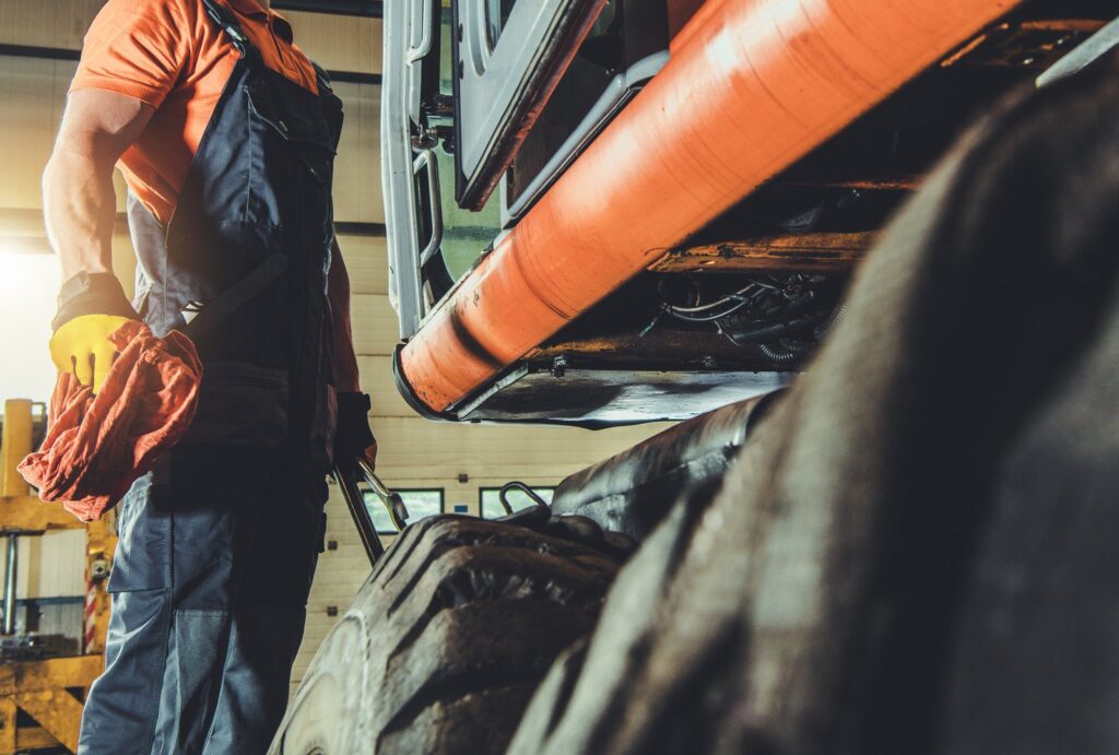 man in a helmet working on a mobile platform