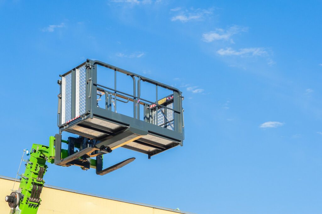 boom lift operator with safety helmet