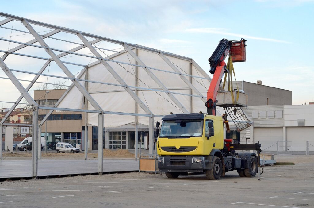 scissor lift among the racks